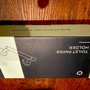 New in box matte black toilet paper holder